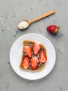 Toast with chocolate and strawberry, Single sandwich with chocolate cheese on white plate, top view Royalty Free Stock Photo