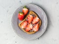 Toast with chocolate and strawberry, Single sandwich with chocolate cheese on white plate, top view Royalty Free Stock Photo