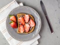 Toast with chocolate and strawberry, Single sandwich with chocolate cheese on white plate, top view Royalty Free Stock Photo