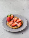 Toast with chocolate and strawberry, Single sandwich with chocolate cheese on white plate, top view Royalty Free Stock Photo