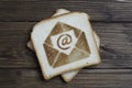 Toast with email sign on dark wood