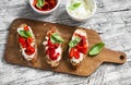 Toast with feta cheese, red roasted peppers and Basil