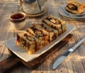 Toast filled with chocolate and cheese on a wooden tray