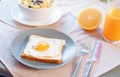 Toast with fried egg, orange juice and cornflakes with milk and berries. Healthy breakfast