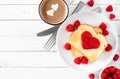 Toast with jam in shape of heart, hot chocolate and raspberries, top view over white wood Royalty Free Stock Photo