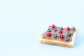 Toast with peanut butter and berries on a blue background Royalty Free Stock Photo