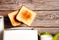 Toast pops out of the toaster, morning breakfast in the kitchen, fried bread health benefits