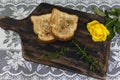 Toast and roses, romantic breakfast on Valentine's Day. Served on an wooden board with copy space Royalty Free Stock Photo