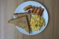 Toast, scrambled eggs, and sausage for breakfast Royalty Free Stock Photo