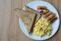 Toast, scrambled eggs, and sausage for breakfast Royalty Free Stock Photo