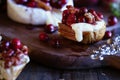 Toast served with Baked Camembert Brie cheese with a cranberry honey and nut relish Royalty Free Stock Photo