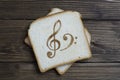 Toast with the sign of music on dark wood
