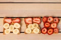 Toast with strawberries and bananas on a wooden background Royalty Free Stock Photo