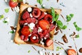 Toast with strawberries, raspberries, cherries, mint and cottage cheese for breakfast. Healthy breakfast, Ruddy bread toast. Royalty Free Stock Photo