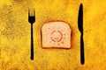 Toast sun symbol fork knife shadow chalkboard yellow chalk Royalty Free Stock Photo