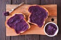 Toast with ube halaya, purple yam spread on a wood serving platter Royalty Free Stock Photo