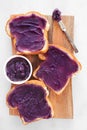 Toast with ube halaya, purple yam spread on a wood serving platter Royalty Free Stock Photo