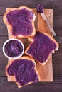 Toast with ube halaya, purple yam spread on a wood serving platter Royalty Free Stock Photo