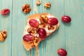 Toast with walnut, ricotta and red grape
