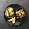 Toast with zucchini grill and salad of olives, cucumbers, tomato, sweet red onion, yellow chili pepper with grilled Royalty Free Stock Photo