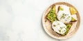 Toasted bread with avocado and poached egg. Delicious breakfast or snack on a light background. banner, menu recipe place for text Royalty Free Stock Photo