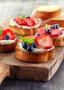 Toasted bread with berries and cream cheese Royalty Free Stock Photo