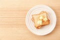 Toasted bread with butter curls on plate Royalty Free Stock Photo