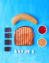 Toasted bread, chocolate, banana, peanut butter, strawberry jam and almond Royalty Free Stock Photo