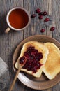 Toasted bread with cranberry jam and tea Royalty Free Stock Photo