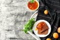 Toasted bread with delicious apricot jam on grey table Royalty Free Stock Photo