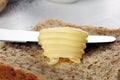 Toasted bread with fresh butter curls. margarine or spread, natural dairy product on breakfast bread Royalty Free Stock Photo