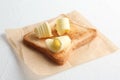 Toasted bread with fresh butter curls on table Royalty Free Stock Photo