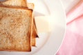 Toasted bread slices with butter pat for breakfast Royalty Free Stock Photo