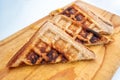 Toasted cheese sandwich on a bread board Royalty Free Stock Photo