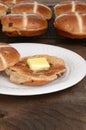 Toasted hot cross bun with butter Royalty Free Stock Photo