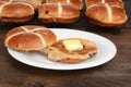 Toasted hot cross bun on plate Royalty Free Stock Photo