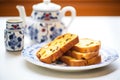 toasted panettone slices with butter on ceramic dish