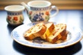 toasted panettone slices with butter on ceramic dish