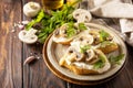 Toasted sandwich from baguettes bread with soft cheese and grilled mushrooms on wooden rustic table. Homemade bruschetta with Royalty Free Stock Photo