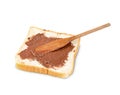 Toasted slice bread with chocolate spread and wooden spatula isolated on white background Royalty Free Stock Photo