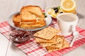 Toasted slices of bread with cheese, cookies, jam and cup of coffee Royalty Free Stock Photo