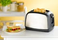 Bread toaster in the kitchen Royalty Free Stock Photo