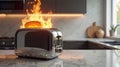 A toaster catching fire in a modern kitchen with burning toast Royalty Free Stock Photo