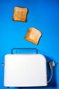 Toaster with slices of bread on a blue background. top view vertical photo. Flat lay