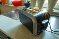 A toaster with slices of toast standing on the kitchen counter Royalty Free Stock Photo