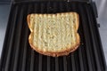 Toastie on a grill close-up view Royalty Free Stock Photo