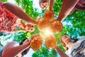 Toasting in Bavarian beer garden. Group of happy friends drinking and toasting beer in Bavarian traditional costume at Royalty Free Stock Photo