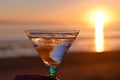 Toasting sunset with Martini at beach