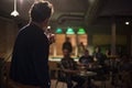 Toastmaster with a microphone at a party