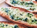 Toasts with basil and garlic close-up on a plate. Royalty Free Stock Photo